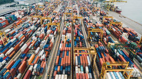 Aerial view of shipping containers on a dock.