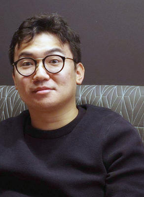Headshot of Toshiaki Yoshida.
